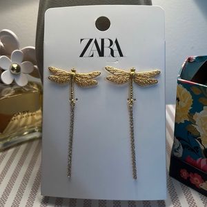 Gold sparkly firefly dangling earrings